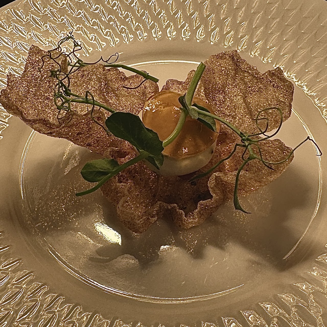 Crispy bitter rice amuse-bouche with steak cream