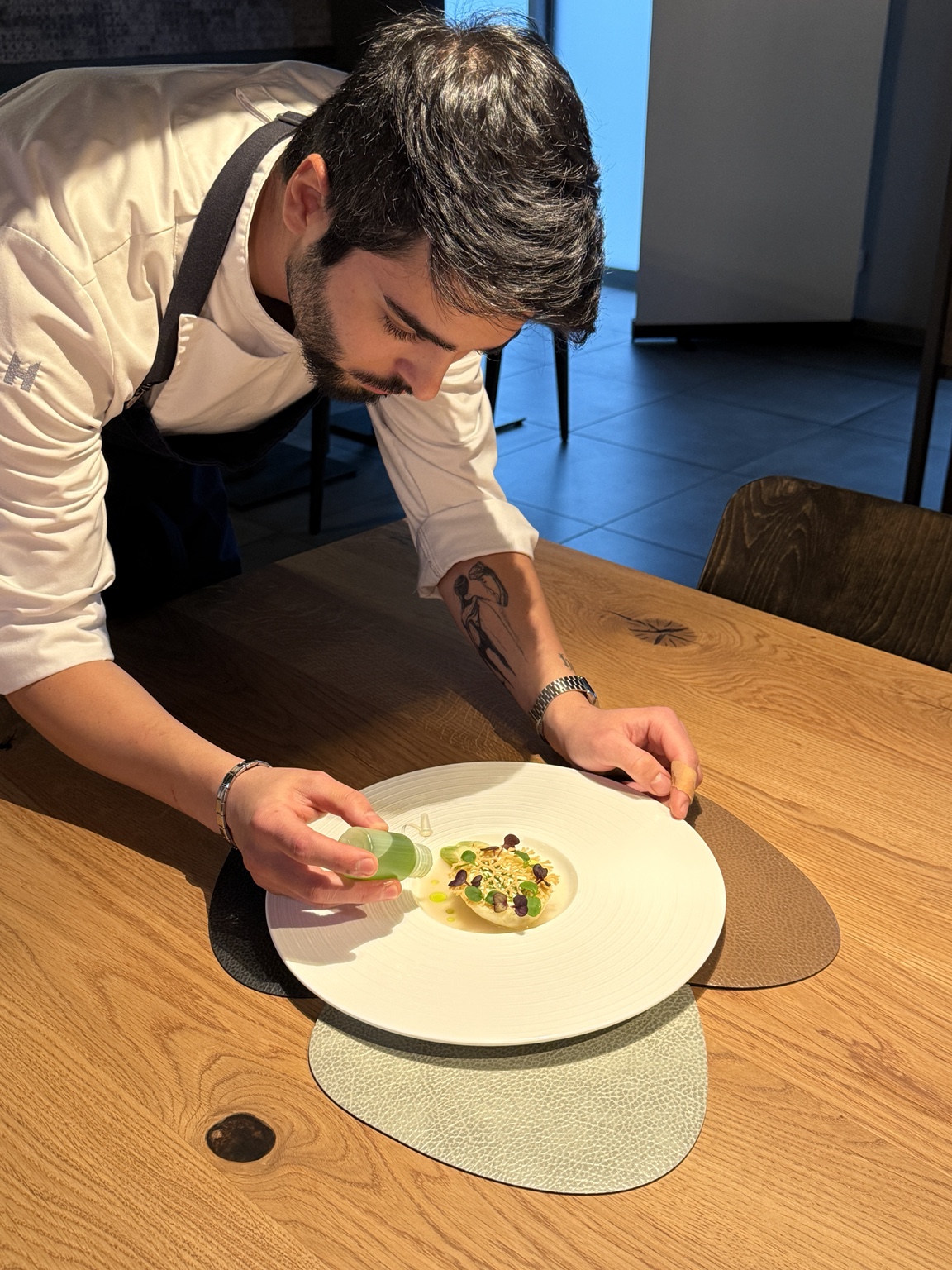 Chef composing a plate at the pass