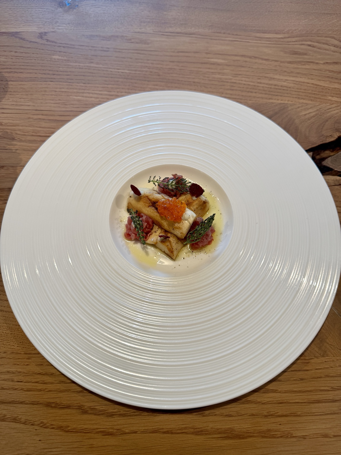 EMBER dish with grilled portobello, gorgonzola cream, beef carpaccio and salmon caviar