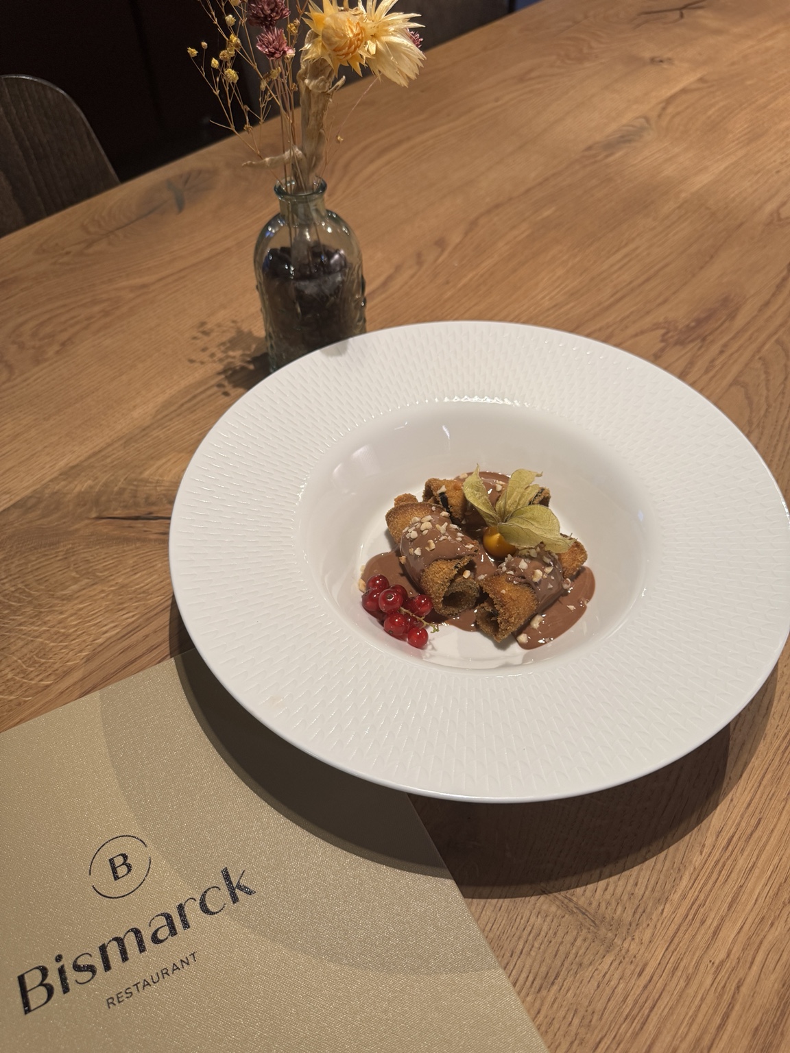 LEV dish with crispy eggplant, Belgian chocolate, roasted hazelnut and physalis
